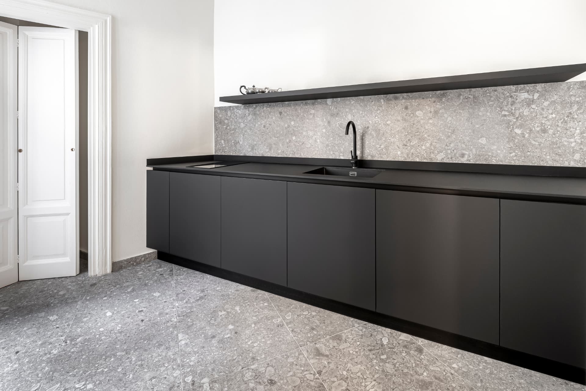 Marble kitchen island continuing the material language of an interior