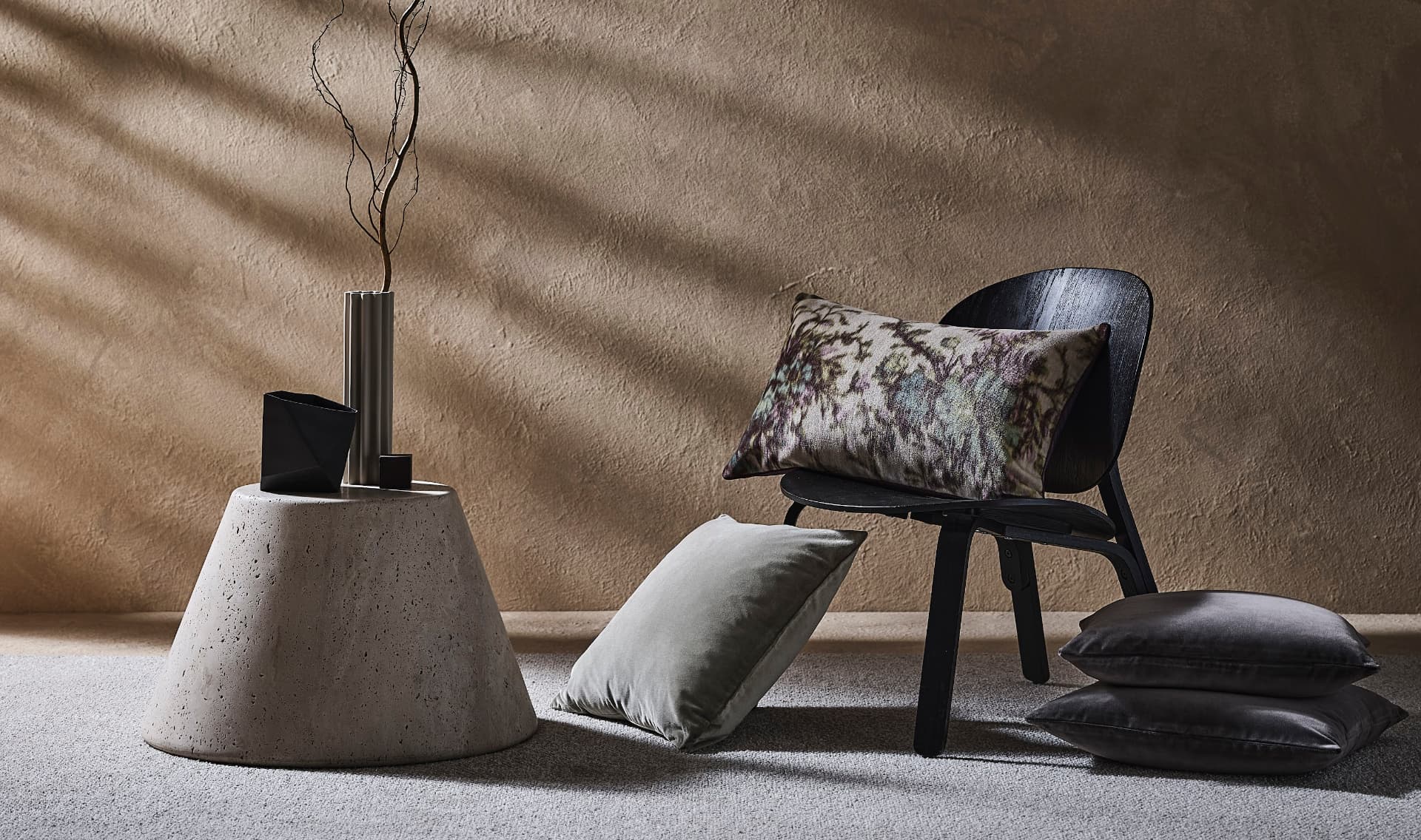 Sculptural furniture styled in a warm interior by Studio IB Milano